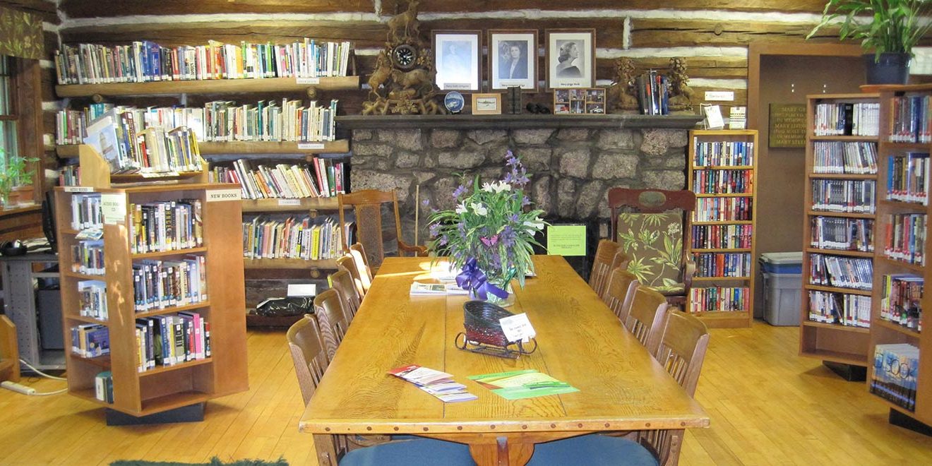 The large table in The Forest Lodge Library in Cable, Wisconsin makes a great work space.