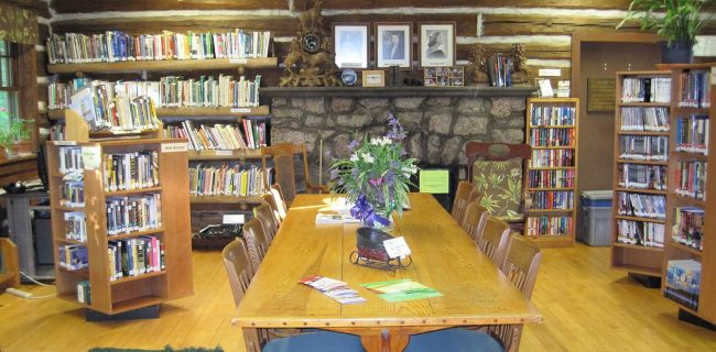 slider-2 The large table in The Forest Lodge Library in Cable, Wisconsin makes a great work space.