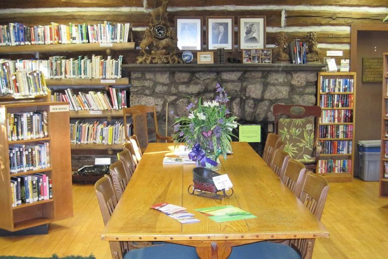 The large table in The Forest Lodge Library in Cable, Wisconsin makes a great work space.