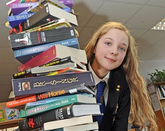 Girl-with-pile-of-books-Hayling-College-The-News-Portsmouth-May-2012-reduced-340
